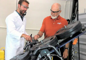 A demonstration of equipment adjustments to Roger Teeter, focusing on inversion technology.