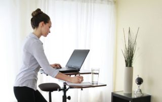 Woman at standing desk.