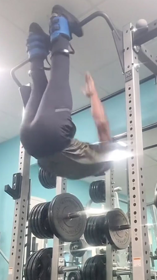 Real Teeter Customers - Person Using Gravity Boots to Invert in Gym