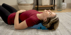 Woman relaxing on MyoTrak Cushion