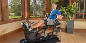 Man working out on Teeter Power10 Elliptical Trainer
