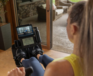 Person watching Teeter Move class on Power10 Rower