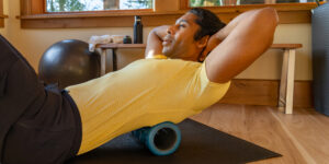 Man using Massage Foam Roller
