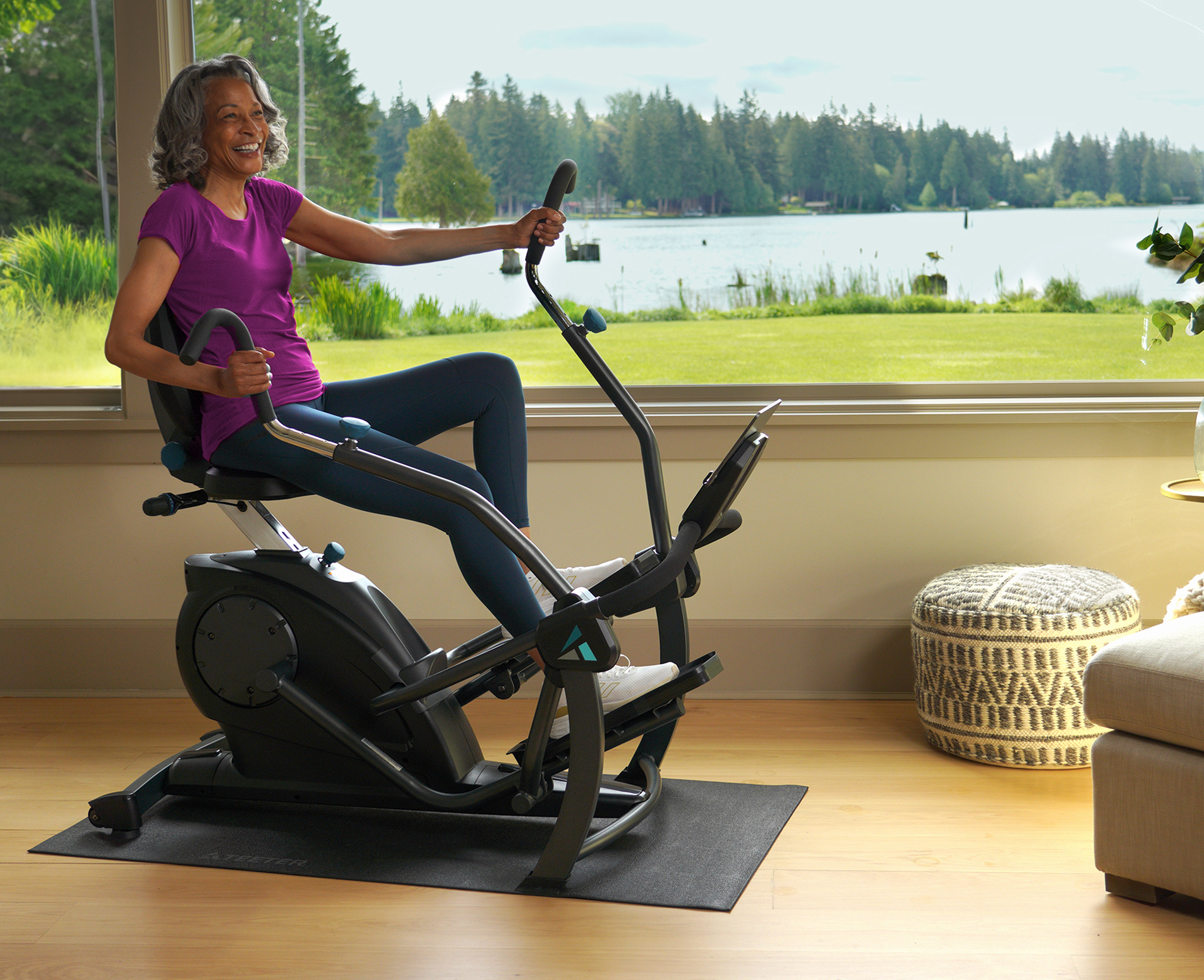Woman exercising on an FreeStep elliptical machine in a bright, airy room