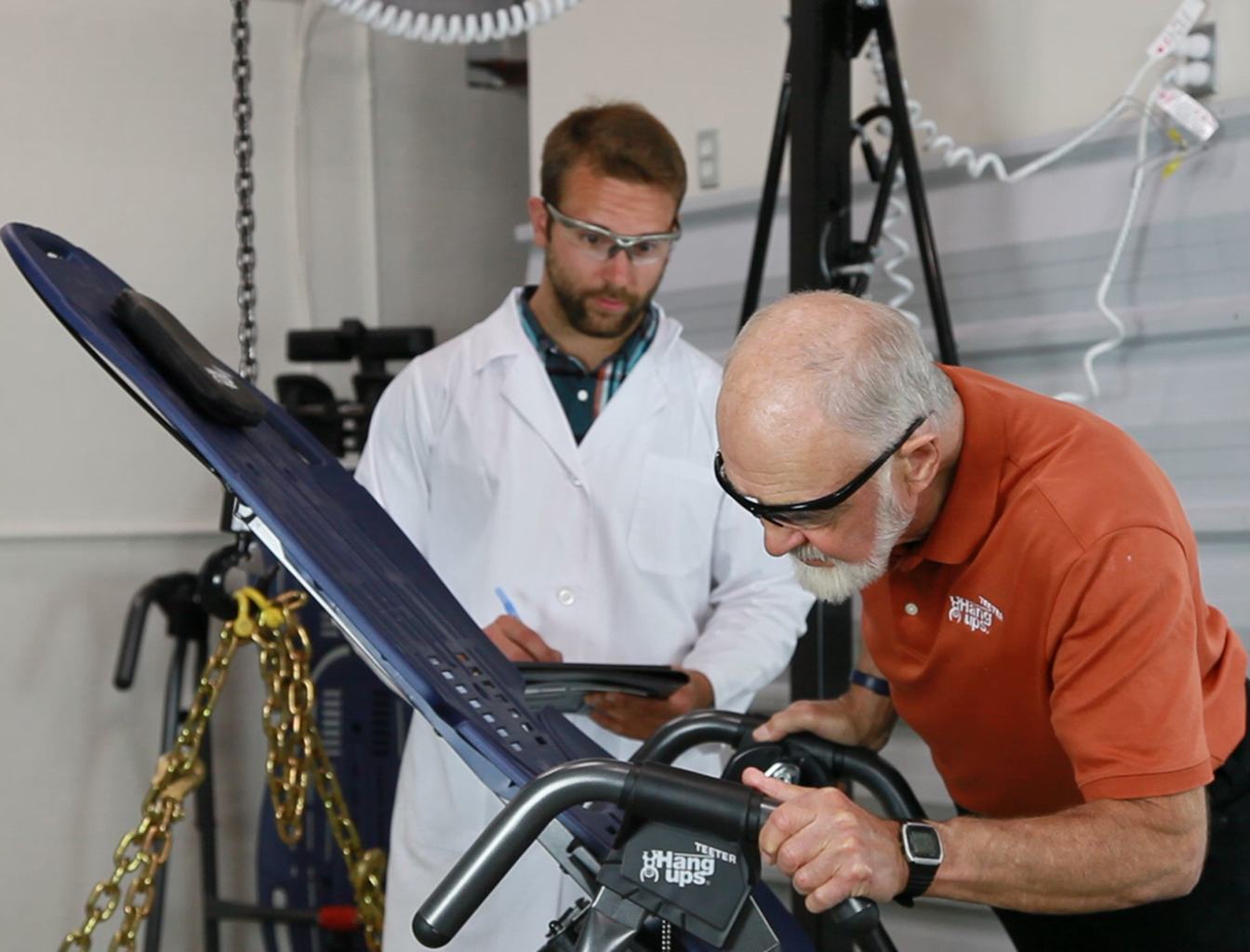 Roger Teeter inspecting inversion table during product testing