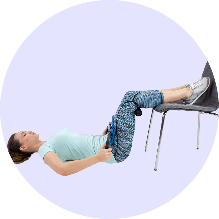 A woman lying down with with feet elevated and the P2 Back Stretcher engaging in a deep stretch