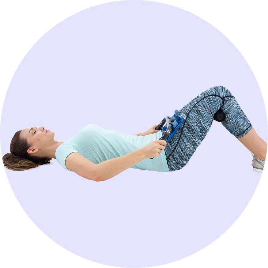 A woman lying down with the P2 Back Stretcher engaging in a moderate stretch