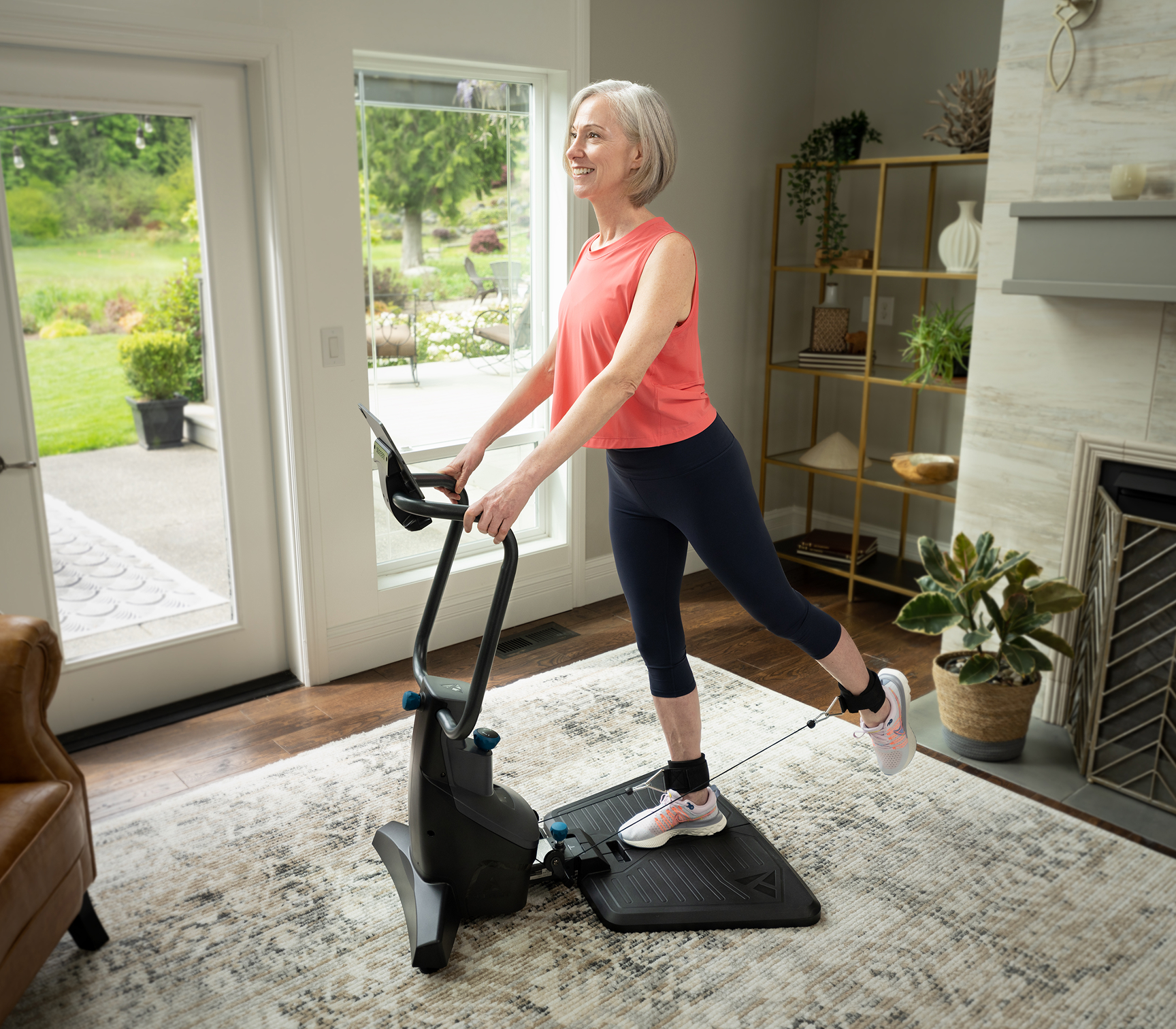 Woman using FitForm home gym for total body resistance training