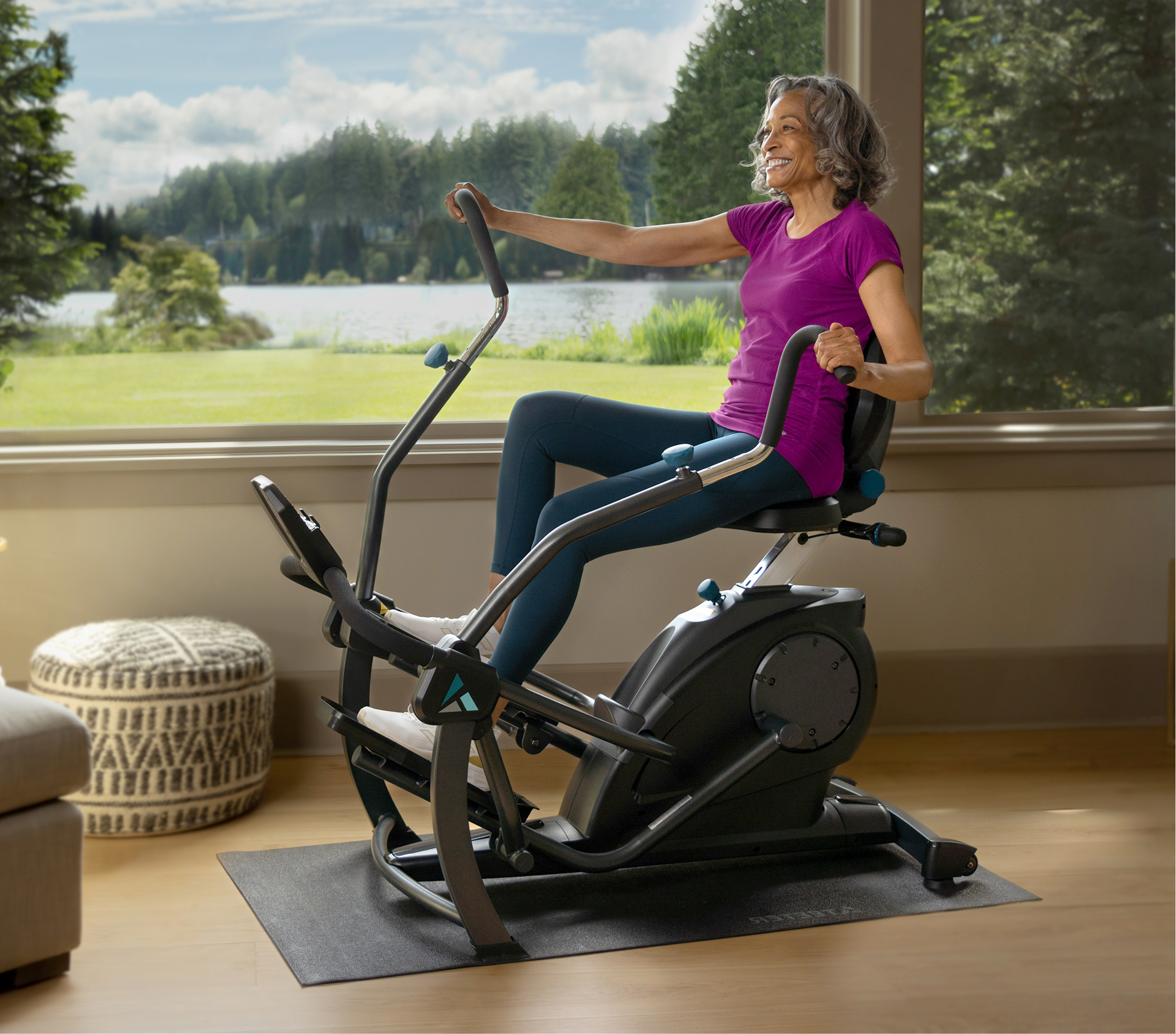 Woman using FreeStep recumbent cross trainer at home