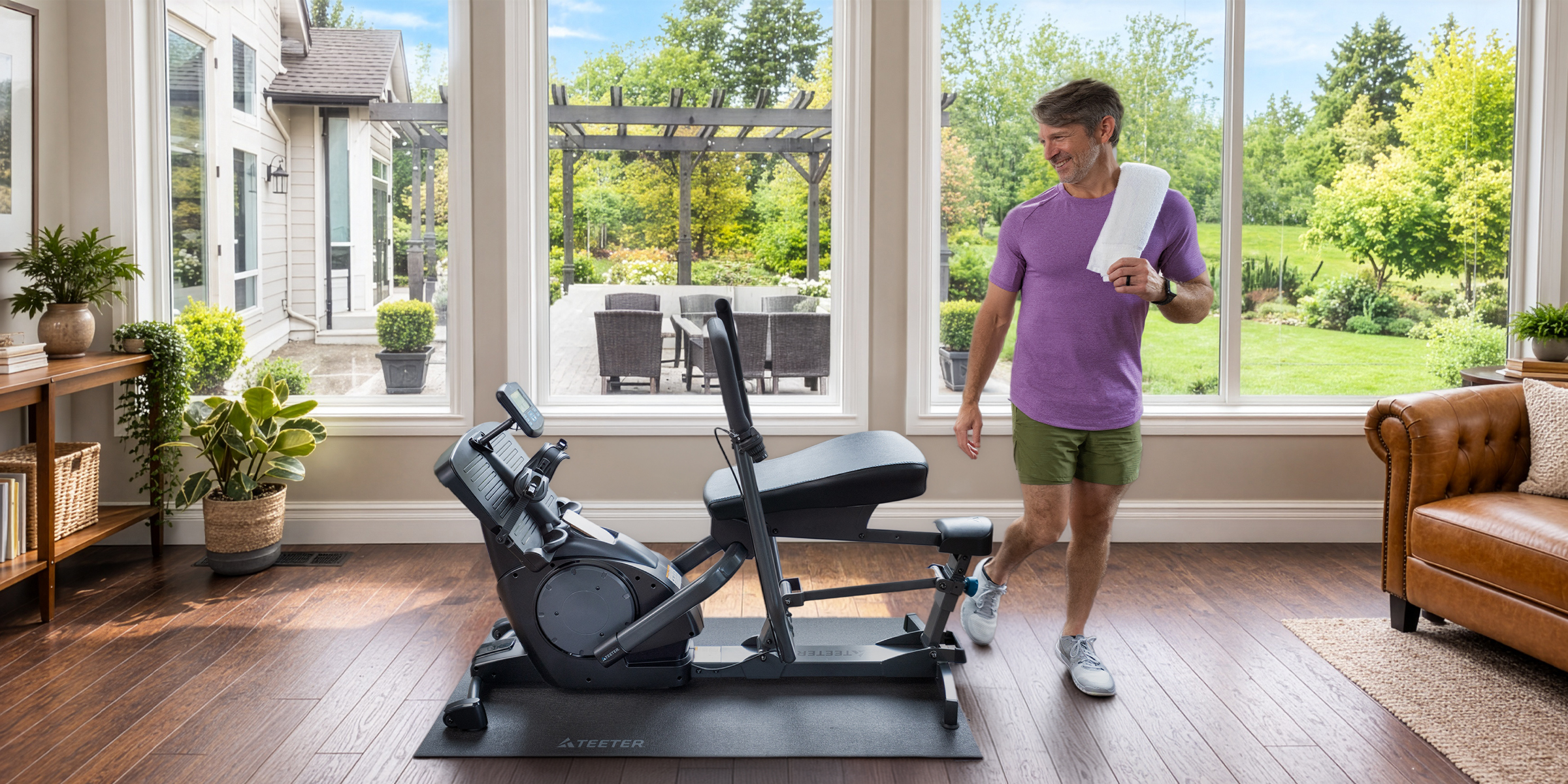 Man after workout out on a Teeter Power10 rower at home